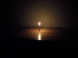 Image of a candle in the dark